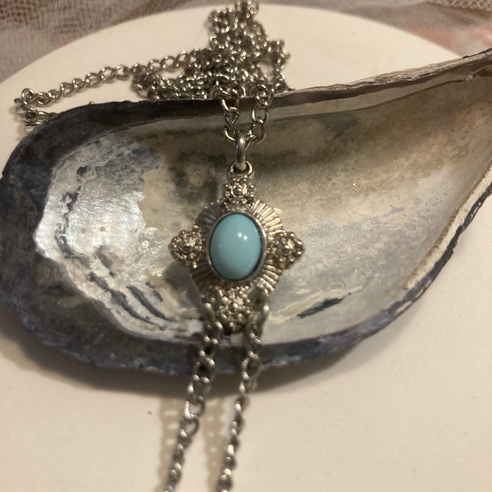Pale turquoise pendant and silver tone chain